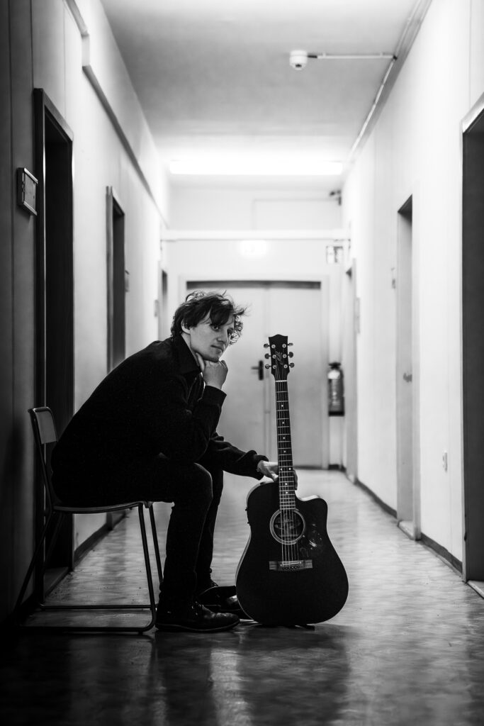 Ludwig Wright sitting in hallway.